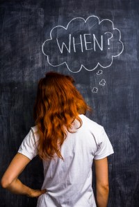 Redhead woman asking when